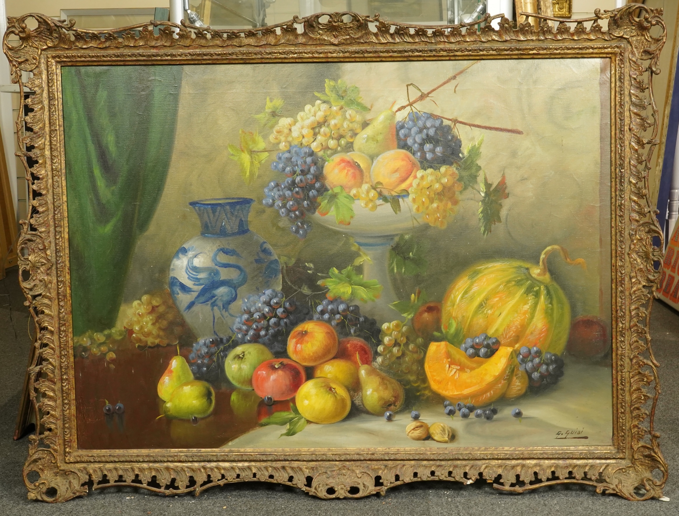 G. Guidi, Still life with a melon, grapes, pears, apples and walnuts, oil on canvas, 67 x 94cm